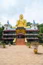 Big golden Buddha statue in wheel-turning pose in Dambulla Golden temple Royalty Free Stock Photo