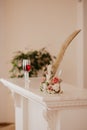 Big golden feather and glasses with rose champagne. Folder with documents on signing marriage certificate, writing materials Royalty Free Stock Photo