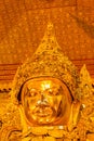 Big golden holy Mahamuni Buddha Image in Buddhist Temple at Mandalay Royalty Free Stock Photo