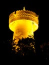 Big golden prayer wheel at night