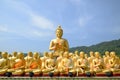 Big Golden and thousand of Golden Buddha statues Royalty Free Stock Photo