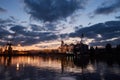 Big grain terminal at seaport. Cereals bulk transshipment from road transport to vessel at night. Loading grain crops on Royalty Free Stock Photo