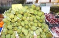 big green artichokes for sale in the open air vegetable market Royalty Free Stock Photo