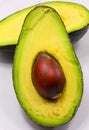 Big green avocado seed from a ripe tropical fruit cut in half Royalty Free Stock Photo