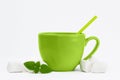 Big green cup with cocoa on white