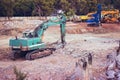 Big green excavator at construction site Royalty Free Stock Photo