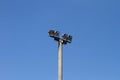 Big grey concrete lighting pole on a blue sky background, objects photo