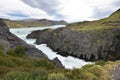 Big grey mountains with a waterfall in front  in Torres del Paine National Park in Chile, Patagonia Royalty Free Stock Photo