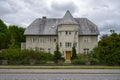 Big grey stone house looking like a mini castle Royalty Free Stock Photo