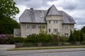 Big grey stone house looking like a mini castle Royalty Free Stock Photo