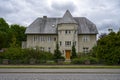 Big grey stone house looking like a mini castle Royalty Free Stock Photo