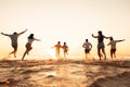 Big group of friends or big family run at sunset beach Royalty Free Stock Photo