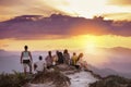 Big group friends mountain top sunset Royalty Free Stock Photo