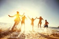 Big group friends sunset sea beach run Royalty Free Stock Photo