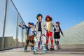 Preteen kids rollerblading outdoors at stadium Royalty Free Stock Photo