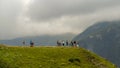 Travelers stand on a mountain and look around at nature Royalty Free Stock Photo