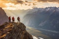 A team of climbers at the top of a high mountain in the light of the setting sun. Royalty Free Stock Photo