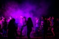 Big group of young people partying on dance floor in night club Royalty Free Stock Photo