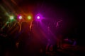 Big group of young people partying on dance floor in night club Royalty Free Stock Photo