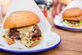 Big hamburger with steak meat and vegetables closeup Royalty Free Stock Photo