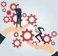 Big hand holding businessman and gears background , business concept Royalty Free Stock Photo