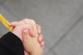 Big hand holding little hand Royalty Free Stock Photo