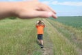 Big hand shelter little tiny boy in field Royalty Free Stock Photo