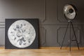 Big handmade moon painting placed on wooden floor in real photo Royalty Free Stock Photo