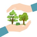 Big hands holding and protect trees, plants, grass. Conservation of nature, ecological problems concept. Environmental Protection