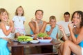 Big happy family with children eats fruit Royalty Free Stock Photo