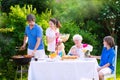 Big happy family enjoying bbq grill in the garden Royalty Free Stock Photo