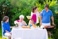 Big happy family enjoying bbq grill in the garden Royalty Free Stock Photo