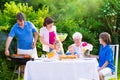 Big happy family enjoying bbq grill in the garden Royalty Free Stock Photo