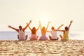 Big happy family or friends having fun against sunset beach Royalty Free Stock Photo