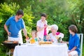 Big happy family grilling meat with grandmother Royalty Free Stock Photo