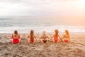 Big happy family or group of five friends is having fun against sunset beach. Beach holidays concept. Royalty Free Stock Photo