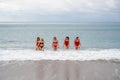 Big happy family or group of five friends is having fun against sunset beach. Beach holidays concept. Royalty Free Stock Photo