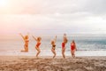 Big happy family or group of five friends is having fun against sunset beach. Beach holidays concept. Royalty Free Stock Photo