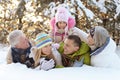 Big happy family having fun in winter park covered with snow Royalty Free Stock Photo