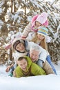 Big happy family having fun in winter park covered with snow Royalty Free Stock Photo