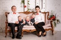 Big happy family: mother, father and triplets sons