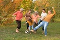 Big happy family playing football in autumn park Royalty Free Stock Photo