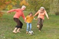 Big happy family playing football in autumn park Royalty Free Stock Photo