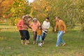 Big happy family playing football in autumn park Royalty Free Stock Photo