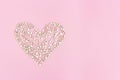 Big heart consists from many small hearts on pink background. Love or holiday concept