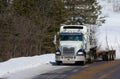 Big heavy transport truck on a forest road in Quebec Royalty Free Stock Photo