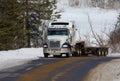 Big heavy transport truck on a forest road in Quebec