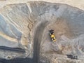 Big heavy wheel loader loading sand into dump truck in sand pit. Heavy industrial machinery concept