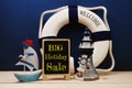 Big Holiday Sale word on easel wooden board with marine decoration concept