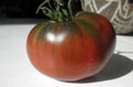 Big Homegrown red and green heirloom Paul Robeson tomato close up